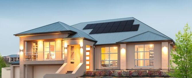 Modern house with solar panels on the roof and landscaped front yard