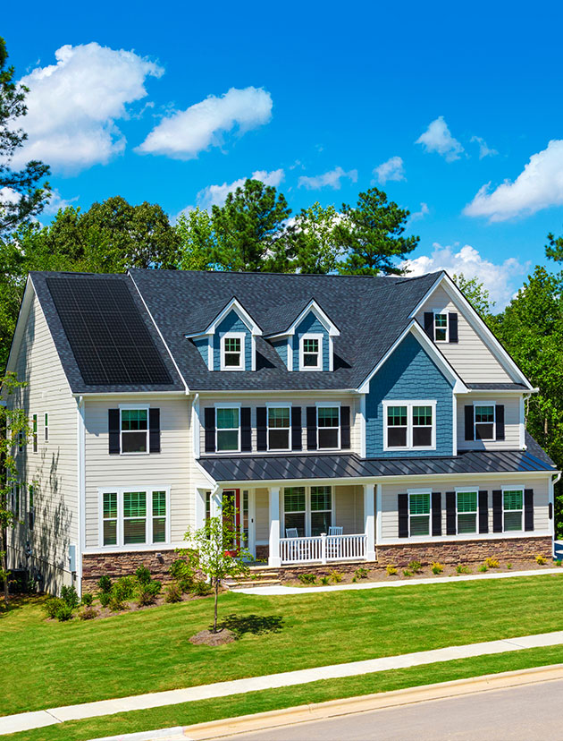 Residential home with solar panels installed by Synergy 768 for energy efficiency and sustainability.