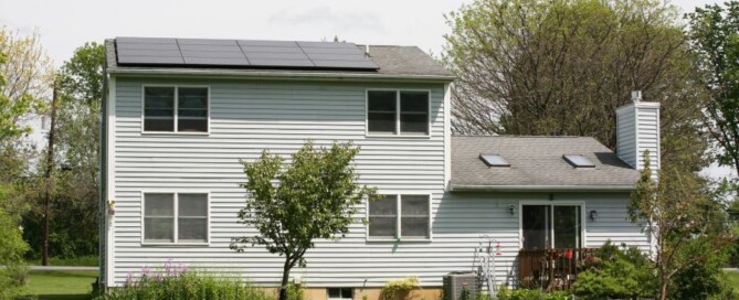 Residential solar panel installation by Synergy 768 on a two-story home, showcasing energy-efficient solar solutions.