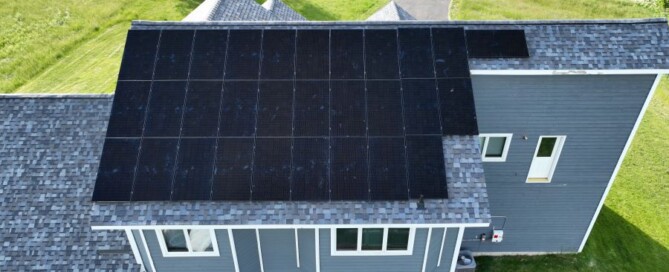 Aerial view of residential solar panels installed by Synergy 768 for energy-efficient home solutions.