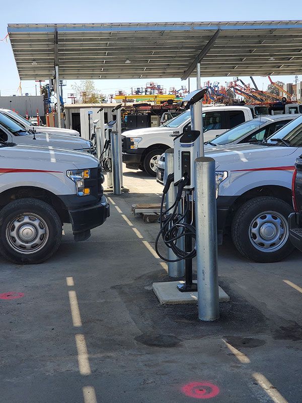 EV charging stations and solar canopies installed by Synergy 768 for commercial energy solutions.